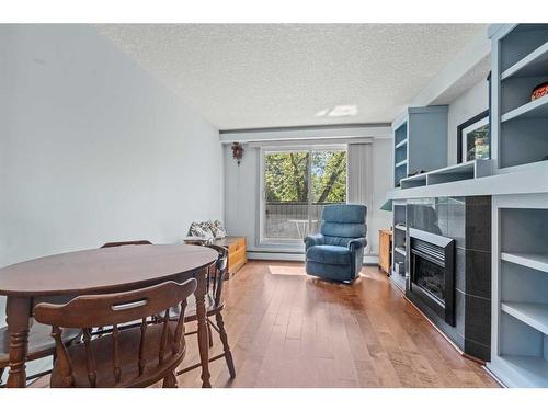 103-333 5 Avenue Ne, Calgary, AB - Indoor With Fireplace