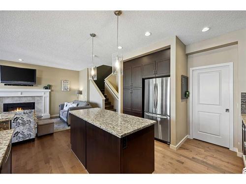 272 Kingsmere Cove Se, Airdrie, AB - Indoor Photo Showing Other Room With Fireplace