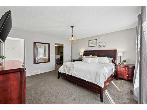 272 Kingsmere Cove Se, Airdrie, AB - Indoor Photo Showing Bedroom