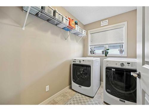 272 Kingsmere Cove Se, Airdrie, AB - Indoor Photo Showing Laundry Room