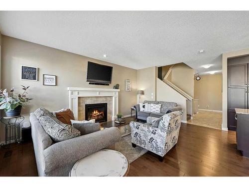 272 Kingsmere Cove Se, Airdrie, AB - Indoor Photo Showing Living Room With Fireplace