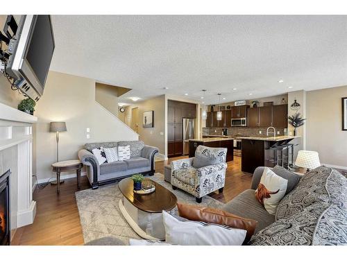 272 Kingsmere Cove Se, Airdrie, AB - Indoor Photo Showing Living Room With Fireplace