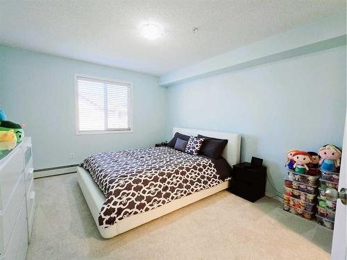 1301-60 Panatella Street Nw, Calgary, AB - Indoor Photo Showing Bedroom