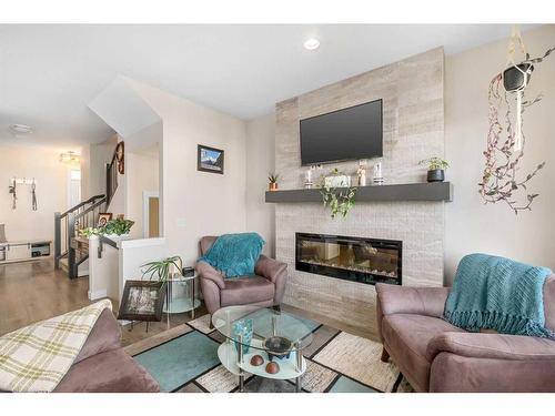 23 Cranbrook Gardens Se, Calgary, AB - Indoor Photo Showing Living Room With Fireplace