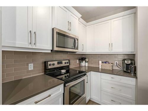 23 Cranbrook Gardens Se, Calgary, AB - Indoor Photo Showing Kitchen With Stainless Steel Kitchen With Upgraded Kitchen