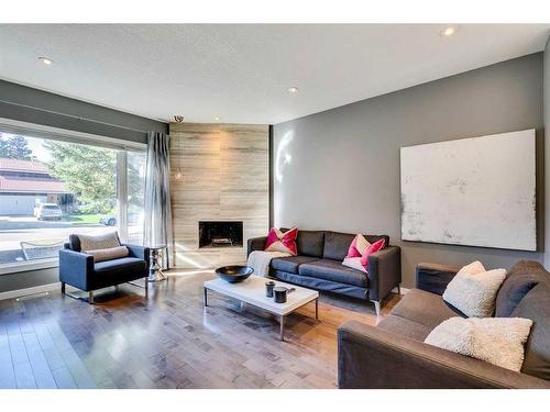 163 Oakmount Road Sw, Calgary, AB - Indoor Photo Showing Living Room With Fireplace