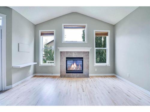 277 West Creek Boulevard, Chestermere, AB - Indoor Photo Showing Living Room With Fireplace