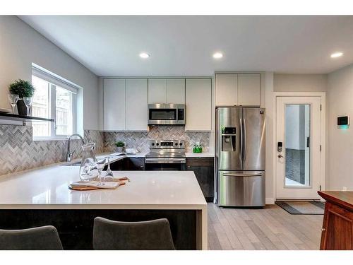 65 30 Avenue Sw, Calgary, AB - Indoor Photo Showing Kitchen With Double Sink With Upgraded Kitchen