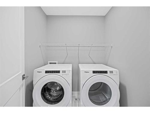 279 Greenwich Drive Nw, Calgary, AB - Indoor Photo Showing Laundry Room