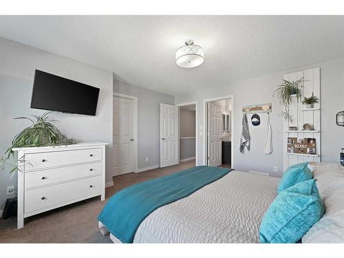 1523 New Brighton Drive Se, Calgary, AB - Indoor Photo Showing Bedroom