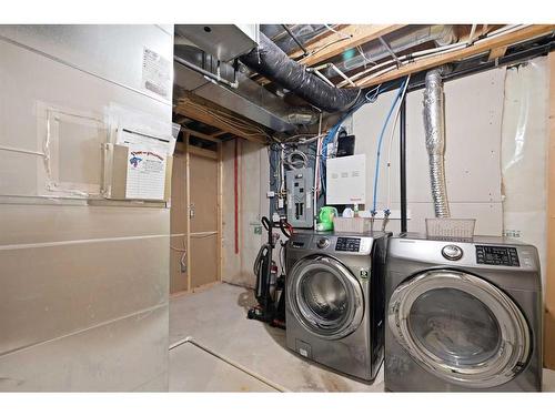 1523 New Brighton Drive Se, Calgary, AB - Indoor Photo Showing Laundry Room