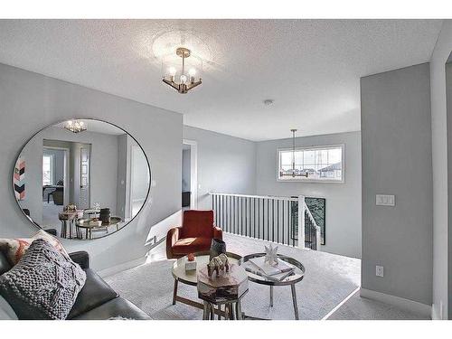 91 Waterford Manor, Chestermere, AB - Indoor Photo Showing Living Room