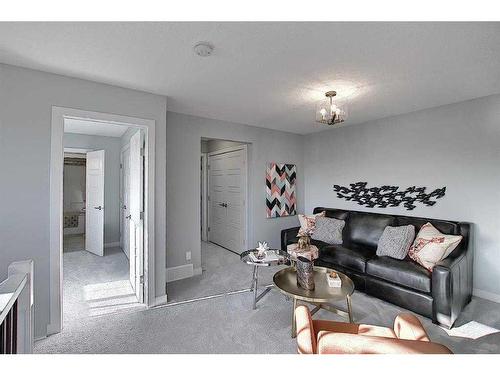 91 Waterford Manor, Chestermere, AB - Indoor Photo Showing Living Room