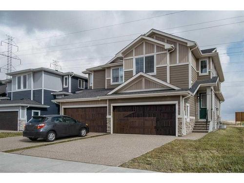 91 Waterford Manor, Chestermere, AB - Outdoor With Facade