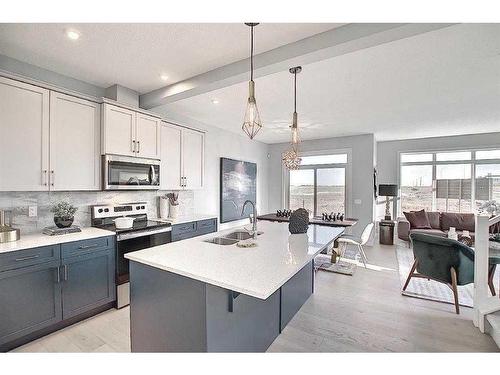 91 Waterford Manor, Chestermere, AB - Indoor Photo Showing Kitchen With Double Sink With Upgraded Kitchen