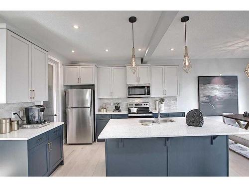 91 Waterford Manor, Chestermere, AB - Indoor Photo Showing Kitchen With Upgraded Kitchen