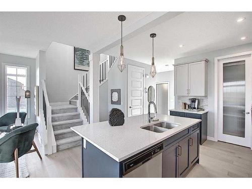 91 Waterford Manor, Chestermere, AB - Indoor Photo Showing Kitchen With Double Sink With Upgraded Kitchen