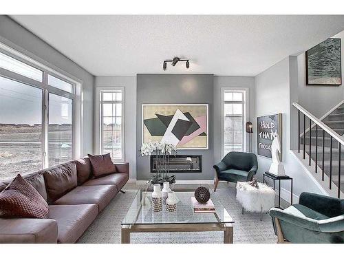 91 Waterford Manor, Chestermere, AB - Indoor Photo Showing Living Room