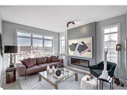 91 Waterford Manor, Chestermere, AB - Indoor Photo Showing Living Room