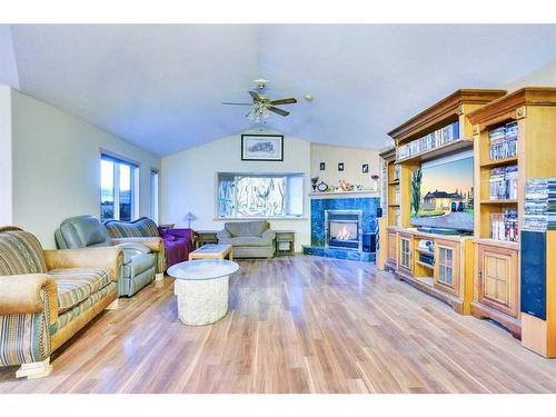 3235 100 Street Se, Calgary, AB - Indoor Photo Showing Living Room With Fireplace