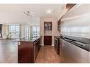 1009-8880 Horton Road Sw, Calgary, AB  - Indoor Photo Showing Kitchen With Stainless Steel Kitchen 