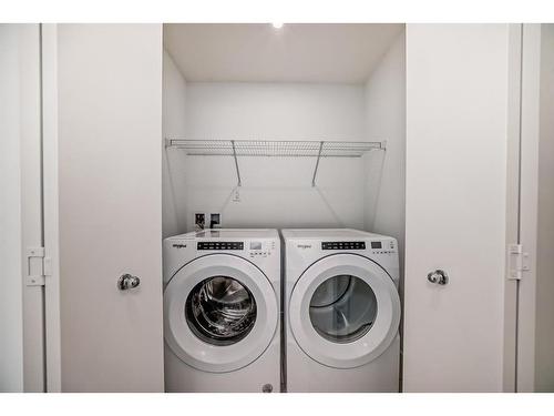 605-280 Chelsea Road, Chestermere, AB - Indoor Photo Showing Laundry Room