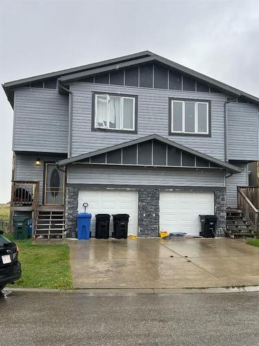 1167 Kildeer Close Se, Didsbury, AB - Outdoor With Facade