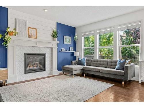 15 Mahogany Point Se, Calgary, AB - Indoor Photo Showing Living Room With Fireplace