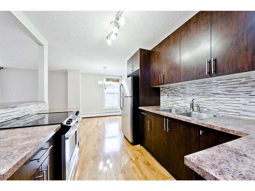 203-616 15 Avenue Sw, Calgary, AB - Indoor Photo Showing Kitchen With Double Sink With Upgraded Kitchen