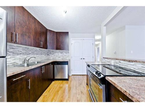 203-616 15 Avenue Sw, Calgary, AB - Indoor Photo Showing Kitchen With Stainless Steel Kitchen With Double Sink With Upgraded Kitchen