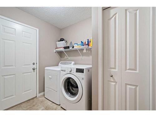 78 Cranston Drive Se, Calgary, AB - Indoor Photo Showing Laundry Room