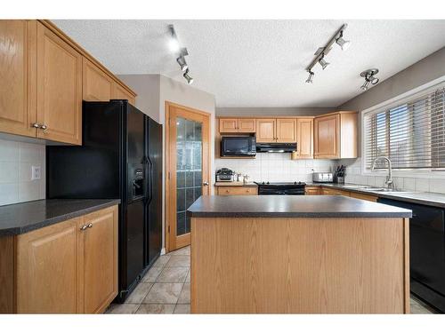 78 Cranston Drive Se, Calgary, AB - Indoor Photo Showing Kitchen With Double Sink