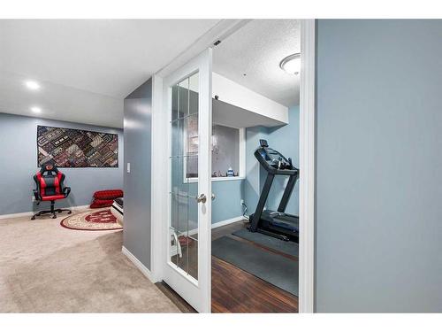 78 Cranston Drive Se, Calgary, AB - Indoor Photo Showing Gym Room