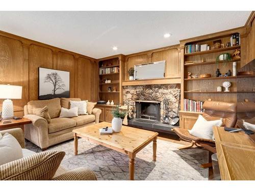 41 Strabane Place Sw, Calgary, AB - Indoor Photo Showing Living Room With Fireplace