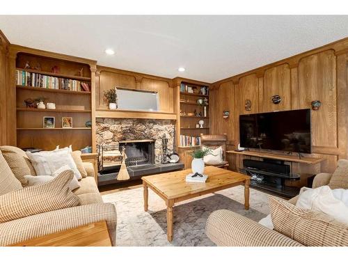 41 Strabane Place Sw, Calgary, AB - Indoor Photo Showing Living Room With Fireplace