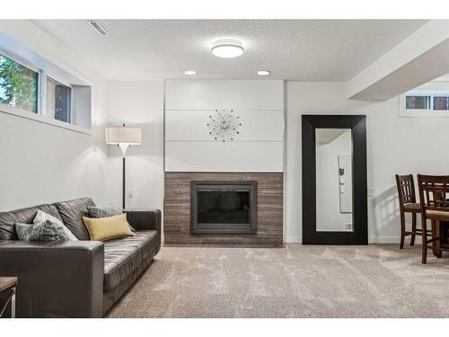 10823 Mapleshire Crescent Se, Calgary, AB - Indoor Photo Showing Living Room With Fireplace