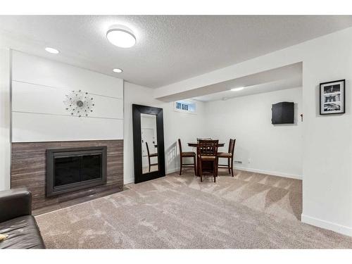 10823 Mapleshire Crescent Se, Calgary, AB - Indoor Photo Showing Living Room With Fireplace