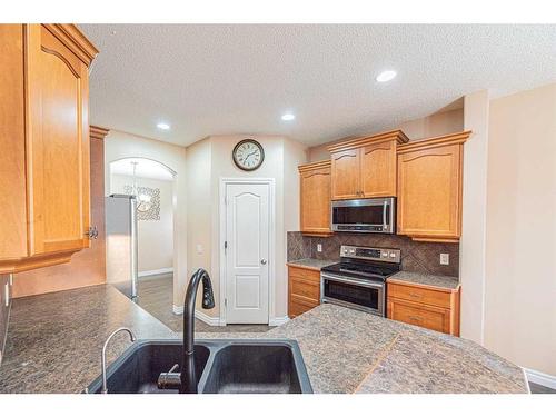 3 Saddleland Crescent Ne, Calgary, AB - Indoor Photo Showing Kitchen With Double Sink