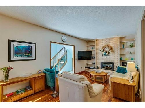 132 Oakmount Road Sw, Calgary, AB - Indoor Photo Showing Living Room With Fireplace