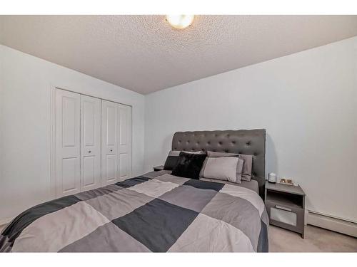 216-5 Saddlestone Way Ne, Calgary, AB - Indoor Photo Showing Bedroom