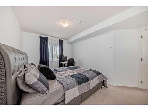 216-5 Saddlestone Way Ne, Calgary, AB - Indoor Photo Showing Bedroom