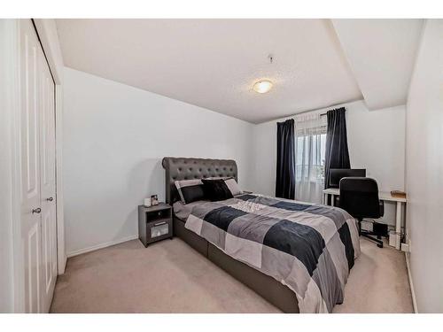 216-5 Saddlestone Way Ne, Calgary, AB - Indoor Photo Showing Bedroom