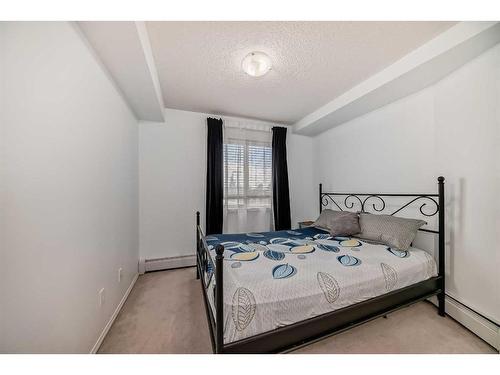 216-5 Saddlestone Way Ne, Calgary, AB - Indoor Photo Showing Bedroom