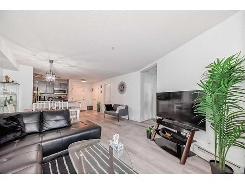 216-5 Saddlestone Way Ne, Calgary, AB - Indoor Photo Showing Living Room