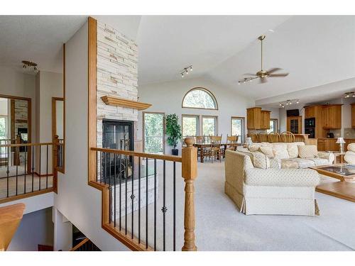 602 Pheasant Close, Pelican Point, AB - Indoor Photo Showing Living Room With Fireplace