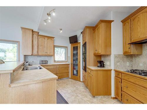 602 Pheasant Close, Pelican Point, AB - Indoor Photo Showing Kitchen With Double Sink