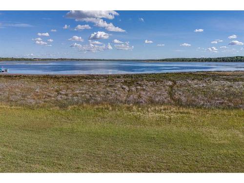 602 Pheasant Close, Pelican Point, AB - Outdoor With Body Of Water With View