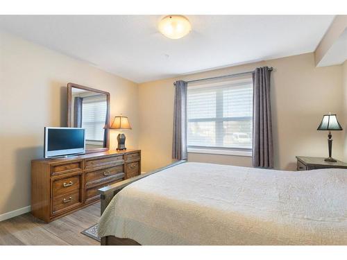 2111-10 Market Boulevard Se, Airdrie, AB - Indoor Photo Showing Bedroom