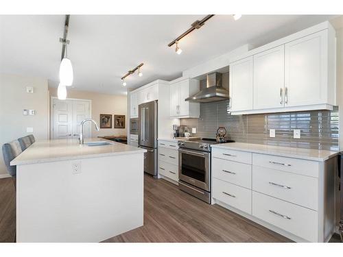 2111-10 Market Boulevard Se, Airdrie, AB - Indoor Photo Showing Kitchen With Stainless Steel Kitchen With Upgraded Kitchen