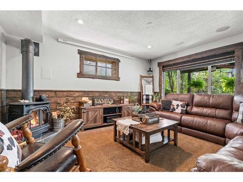 184 West Creek Landing, Chestermere, AB - Indoor Photo Showing Living Room With Fireplace